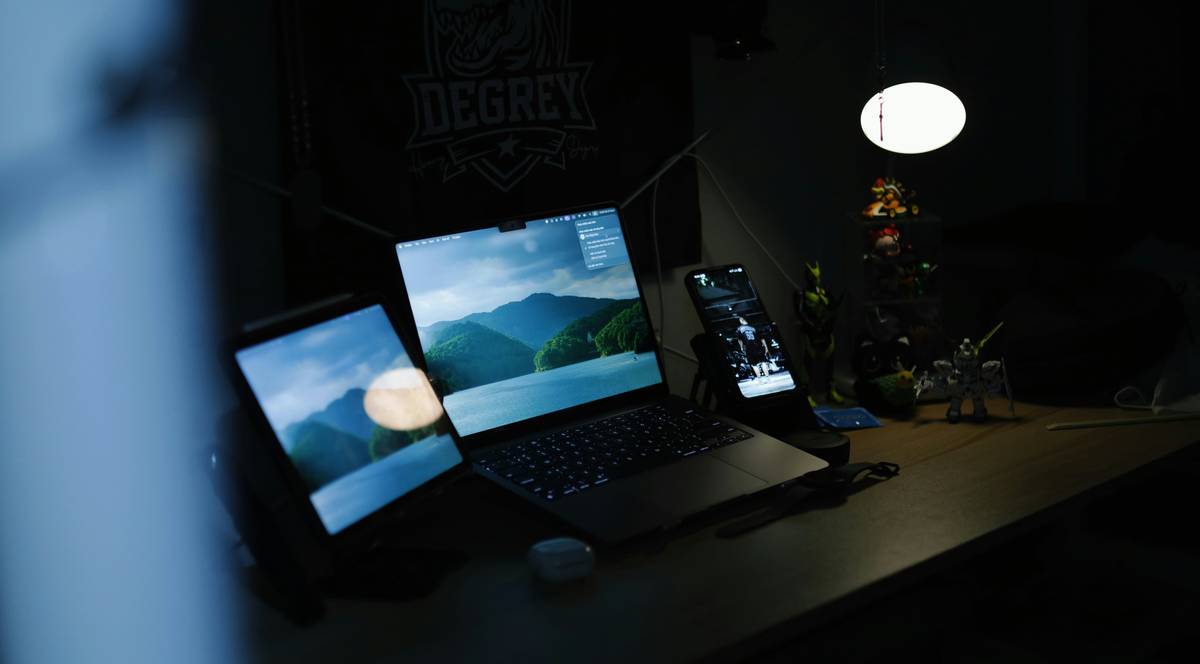 must have tech gadgets setup on minimalist desk with dual monitors and mechanical keyboard