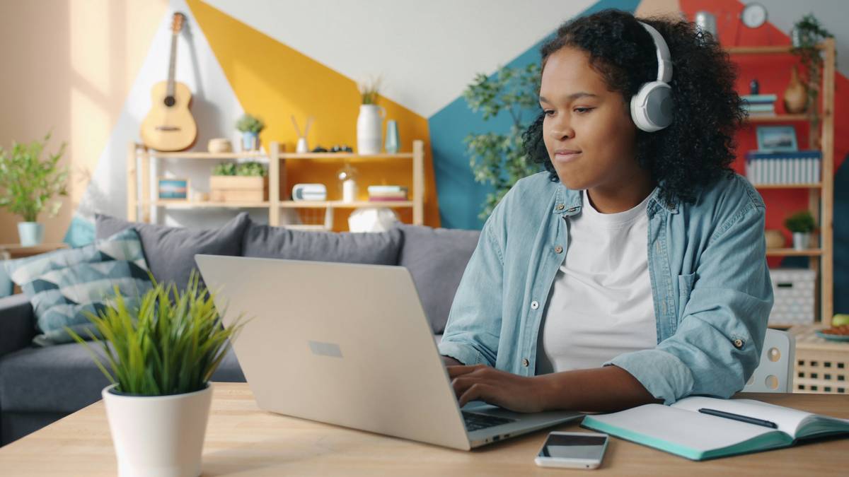 tech gift guide featuring laptop, wireless earbuds, mechanical keyboard, and portable SSD arranged on a desk